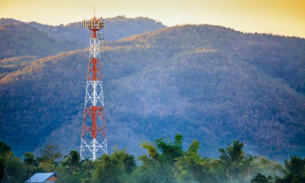 Telecommunication tower on the field 5G cell tower in the environment