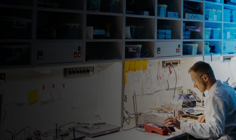 man working with U/L2050/60 X-Series USB / LAN Wide Dynamic Range Peak and Average Power Sensors Banner